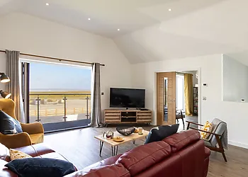 Relax in front of the TV with a good film(with distant sea views)