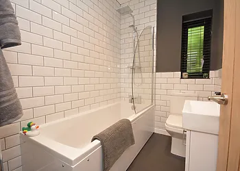 Contemporary bathroom with towels provided