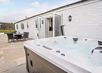 Embrace the views from this stylish patio and hot tub