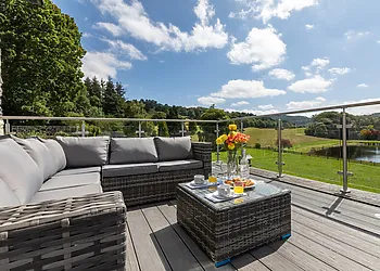 Comfortable rattan furniture and panoramic views on the balcony