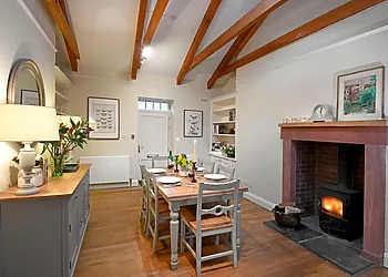 The spacious dining room with wood burner, ideal for those cooler evenings