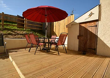 Sunny decked area leads from the large and spacious kitchen