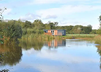 Nestled on the side of a one acre lake, a perfect lodge for two
