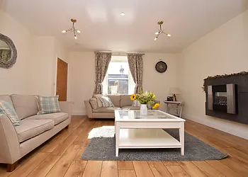 The lovely light and bright lounge with feature fire