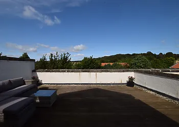 Step outside onto the spacious roof top patio area and admire the views