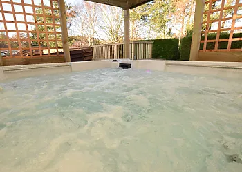 Relax and unwind in the private housed hot tub