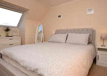 The lovely double bedroom with ample storage space and Smart TV