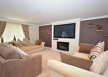 Lounge with large wall mounted TV/DVD and Sky TV