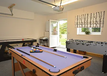 Games room wiht pool table, table football and hockey table