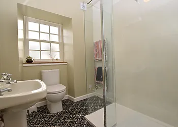 The stylish ground floor shower room with large walk-in style shower
