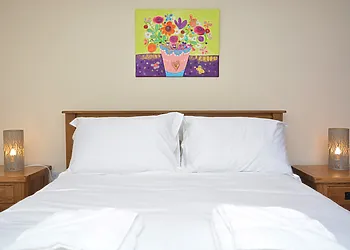 Relax in the bright and airy bedroom