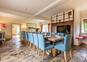 Charming dining room with warming wood burner 