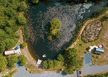 Aerial view of the lake and both pods with on-site parking along side