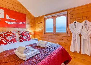 Relax on the comfy double bed and enjoy the views
