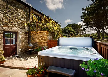 Enjoy lazing in the hot tub after an al fresco meal