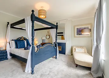 Master bedroom with four poster bed