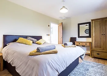 King-size bedroom with en-suite shower room.