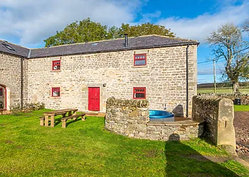 View of this lovely refurbished barn with hot tub