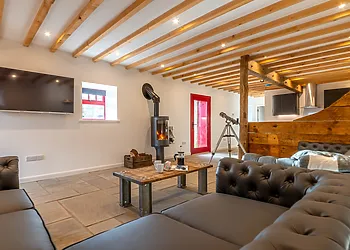 The living area is a great place to watch a movie or relax with a coffee