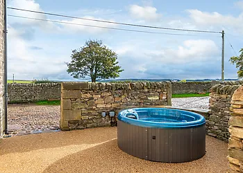 Enjoy the hot tub and take in the rolling countryside views