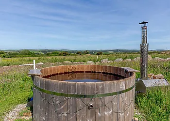 Enjoy the view from the wood fireed hot tub