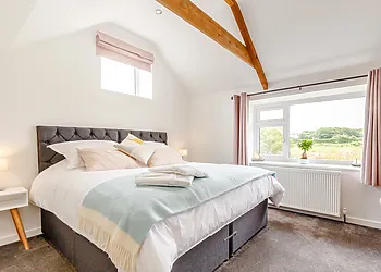 Vaulted ceilings and views from your bed