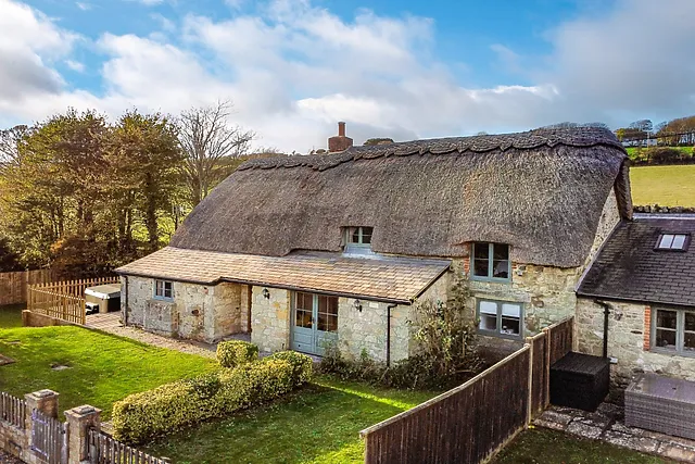 A thatched hot tub cottage near Niton with views over rolling farmland
