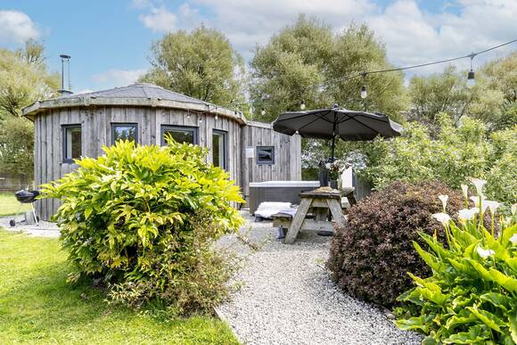Fern Leaf Roundhouse at East Thorne, a pet friendly lodge with a hot tub