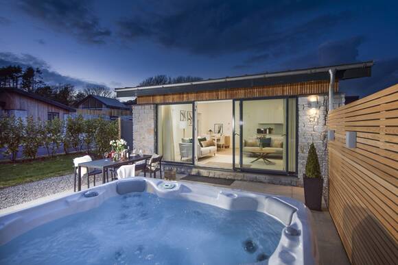 Salt Life is an eco home with a large hot tub on the edge of the dunes at Hayle