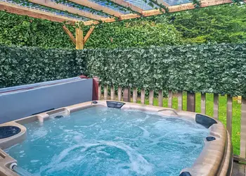Hazel hot tub by day