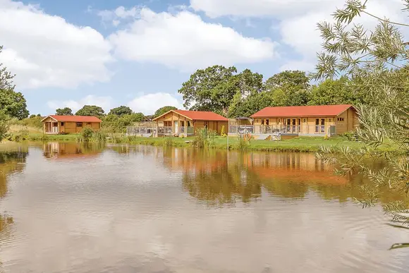 Gadlas Park carp fishing lake with luxury lodges