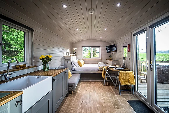 Book Shepherds Hut Spa accommodation at Glampio Gelli Glamping. Best UK  Price Guarantee