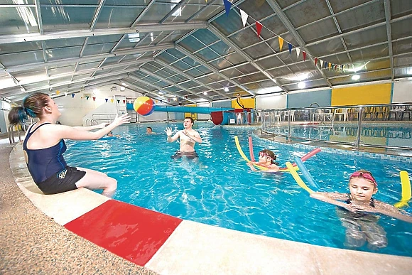 Indoor heated swimming pool with waterslide