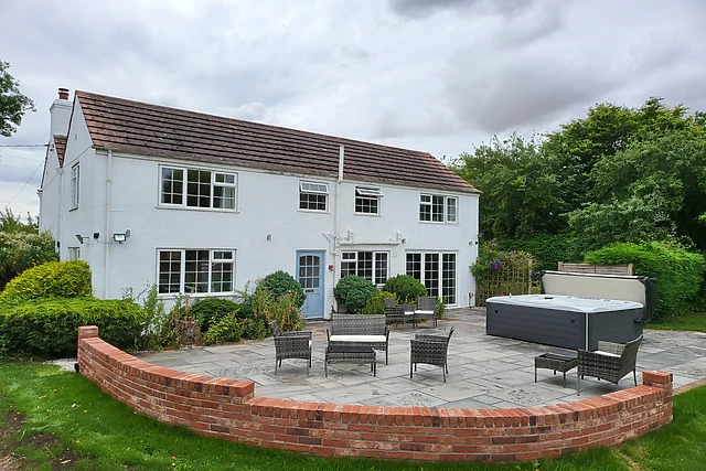 Holly Cottage sleeps 12 and its eight-seater hot tub is big enough for the whole group