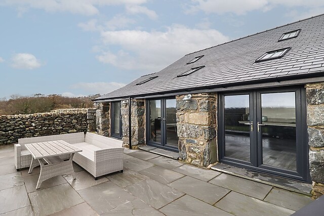 Gaerau Bach has sea views and a hot tub in its wraparound garden on the Cardigan Bay coast