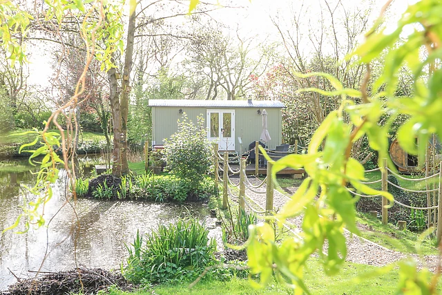A shepherd's hut for two on the same lake as the Badwell Ash lodge, with a wood burner inside